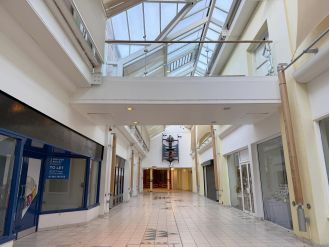 UK's most deserted shopping centre at Christmas, only three stores are open.