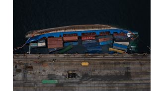 A 5,215-ton cargo ship tips over, causing the crew to escape for safety.
