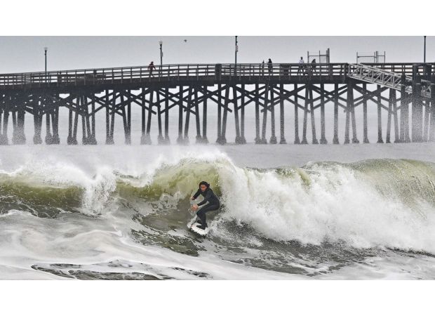 Man fatally trapped under debris on California beach after being hit by huge wave.