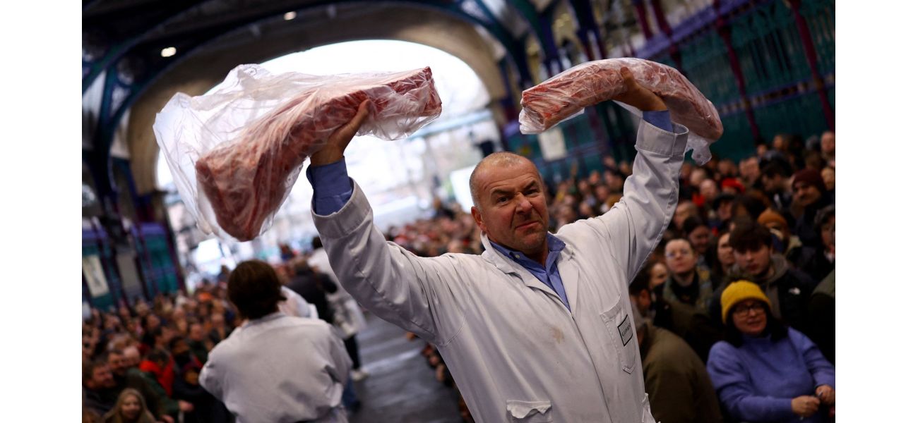 Britain's oldest meat market, which has been operating for 800 years, holds a Christmas Eve auction before possibly closing down.