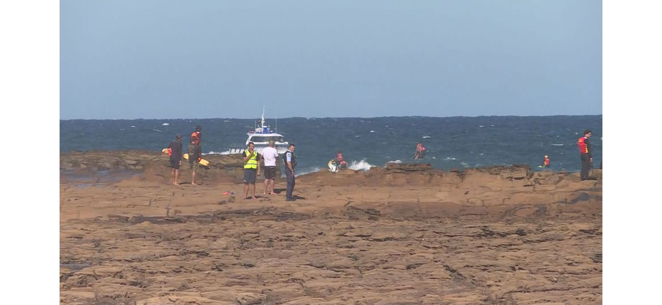Authorities are frantically looking for a young boy who was swept away from the rocks at a beach on the NSW Central Coast.