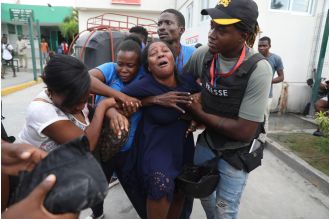 Gang assault in Haiti kills 2 journalists and injures others during coverage of hospital reopening.