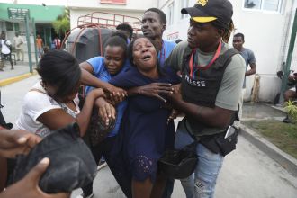 A gang's violent assault on the re-opening of a hospital in Haiti resulted in fatalities.