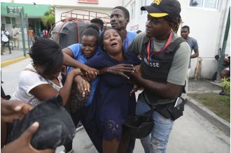 Journalists in Haiti hospital attacked by gang, 2 killed.