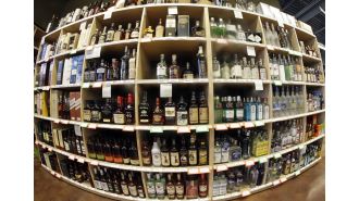 Neighborhood liquor shops file lawsuit against Colorado, alleging that state licenses are biased towards large retail chains such as Costco, Walmart, and Target.