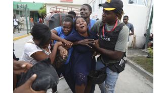 Journalists in Haiti hospital attacked by gang, 2 killed.