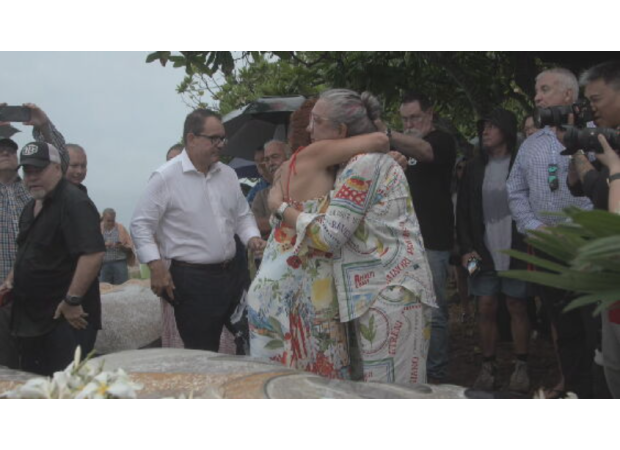 People who survived Cyclone Tracy gather to remember those who died, as a 50-year memorial is unveiled.