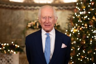 King Charles III highlights healthcare workers in Christmas address amid royal illnesses.