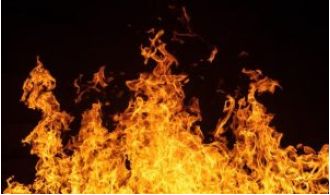 A man sets himself on fire near Parliament in a suicide attempt.