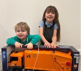 A toddler's day was made by binmen who gave him a special gift.