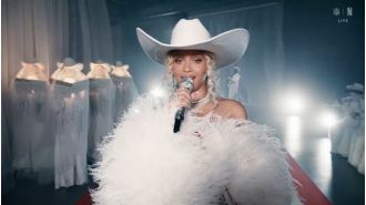 Beyoncé debuts Cowboy Carter at NFL event, surprises fans with family appearance.
