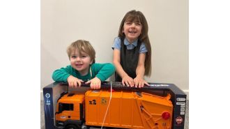 A toddler's day was made by binmen who gave him a special gift.