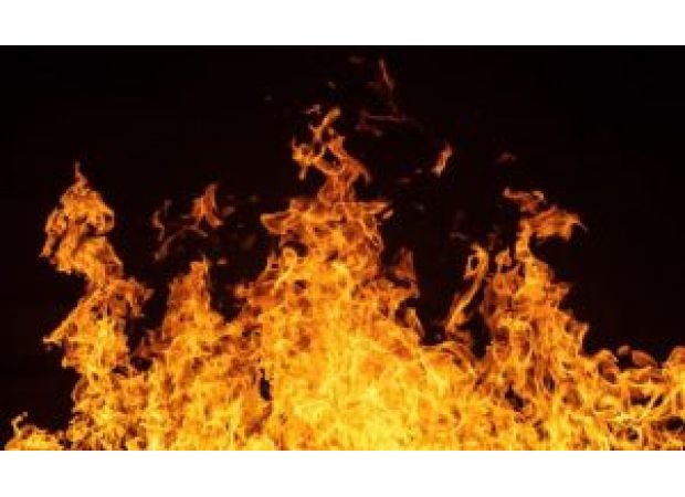 A man sets himself on fire near Parliament in a suicide attempt.