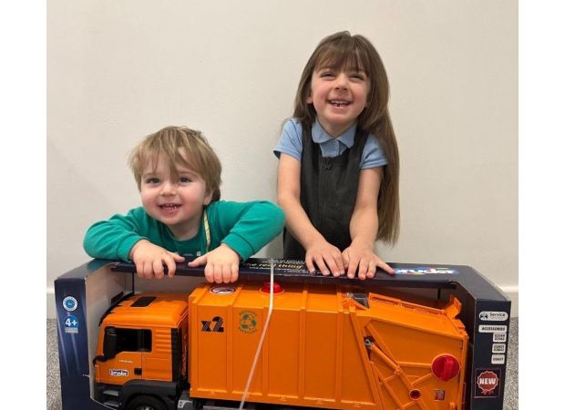 A toddler's day was made by binmen who gave him a special gift.