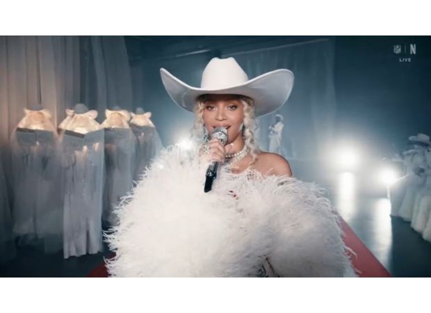 Beyoncé debuts Cowboy Carter at NFL event, surprises fans with family appearance.