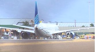 Police find gruesome body in airplane's wheel compartment.