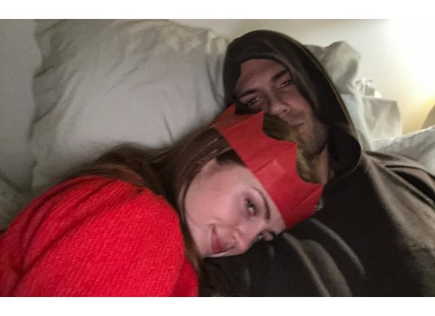 The singer Max George embraces Maisie Smith when he arrives home for the holidays.