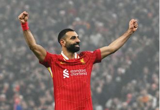 Salah admits title hopes after reaching milestone in Liverpool's win over Leicester.