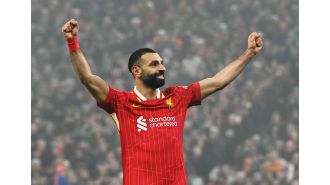 Salah admits title hopes after reaching milestone in Liverpool's win over Leicester.