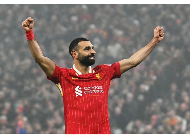 Salah admits title hopes after reaching milestone in Liverpool's win over Leicester.