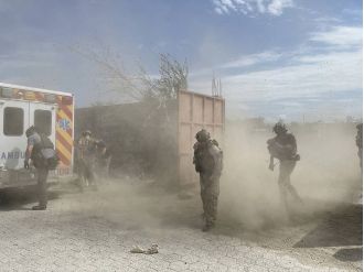 Haitian gang kills 3 at hospital during press conference.