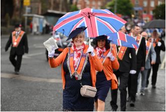 Did Queen Elizabeth describe the Orange marches as foolish activities?