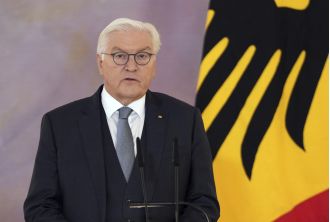German president dissolves parliament and schedules new election for upcoming year.