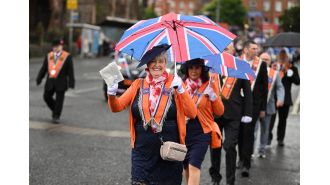 Did Queen Elizabeth describe the Orange marches as foolish activities?