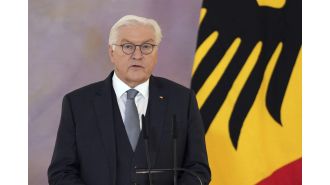 German president dissolves parliament and schedules new election for upcoming year.