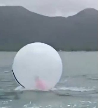 8-year-old boy rescued from the ocean in an inflatable bubble.