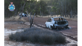 A woman is accused of murder after a man's body was discovered in a car that had been set on fire in Western Australia.