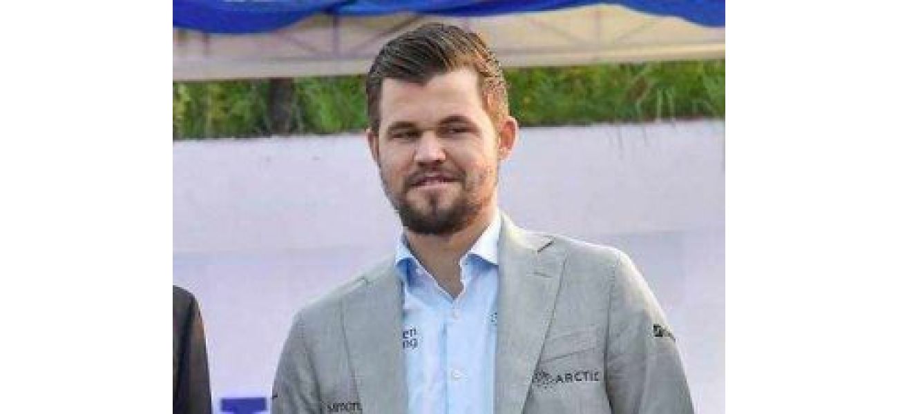 Carlsen disqualified from chess competition for breaking dress rules.