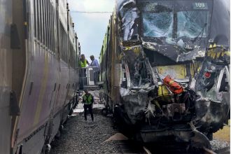 Fifteen people hurt as speeding train collides with fire truck.