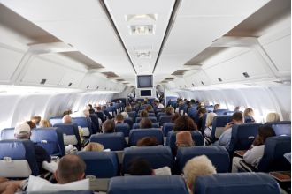 Which seat provides the most protection during a plane crash?