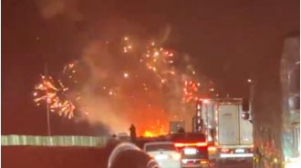 Truck with fireworks crashes and causes amazing highway show.