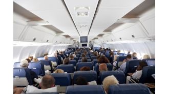Which seat provides the most protection during a plane crash?