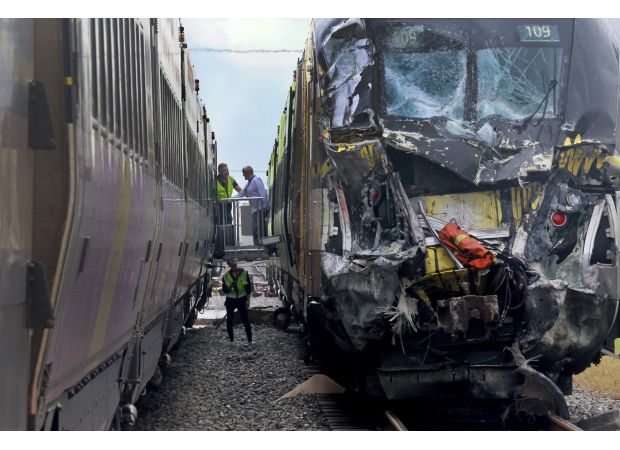 Fifteen people hurt as speeding train collides with fire truck.