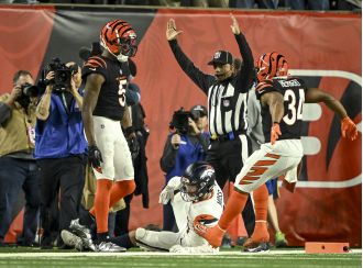 Denver's chances for the playoffs are uncertain as their coach's decision to play for overtime backfired in a 30-24 defeat against Cincinnati.
