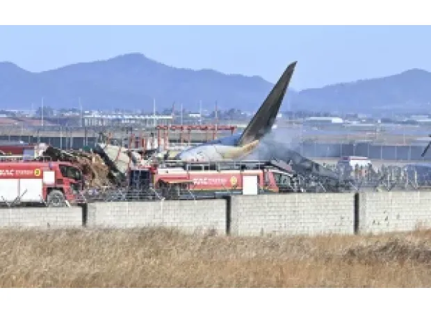 120 killed in plane crash as it veers off runway and hits fence in South Korea.