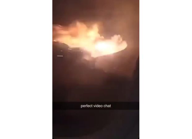 Airline plane experiences fire when wing hits runway during landing.