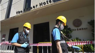 Three tourists die in fire at Bangkok hotel, popular with visitors.