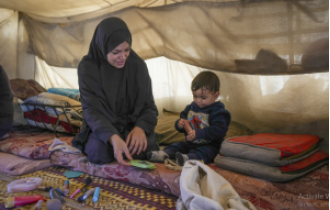 Palestinian women in Gaza endure daily challenges in crowded tent camps, with little privacy and harsh living conditions.