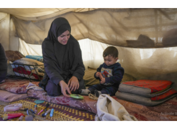 Palestinian women in Gaza endure daily challenges in crowded tent camps, with little privacy and harsh living conditions.