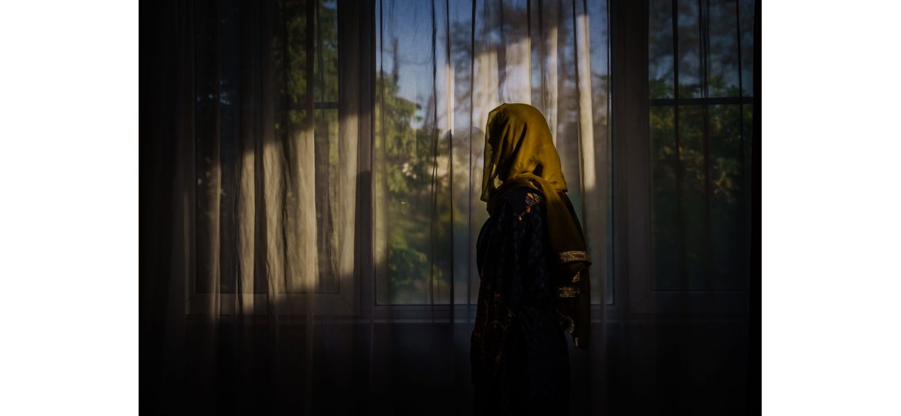 The Taliban forbids women from being visible in nearby houses.