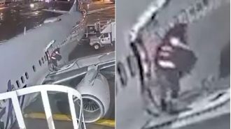 Panicked passenger exits plane through emergency door onto wing