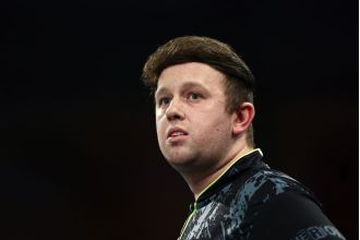 Rydz pokes fun at his hair during World Darts Championship, amusing fans.