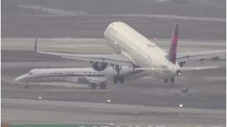 A plane from a commercial airline almost collides with a sports team's aircraft.
