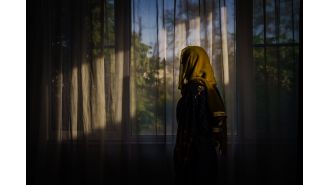 The Taliban forbids women from being visible in nearby houses.