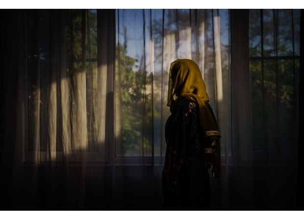 The Taliban forbids women from being visible in nearby houses.