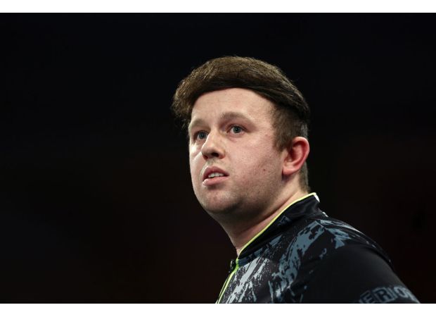 Rydz pokes fun at his hair during World Darts Championship, amusing fans.